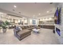 Spacious living room with an entertainment center, modern fireplace, and open floor plan at 461 Highview Ridge Ave, Las Vegas, NV 89138