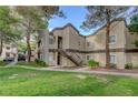 A beautiful condo building with well-maintained landscaping and a welcoming entrance at 5250 S Rainbow Blvd # 2183, Las Vegas, NV 89118