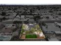 Aerial perspective showcasing the home's backyard, perimeter, and tree coverage within a neighborhood setting at 6320 Dayton Ave, Las Vegas, NV 89107