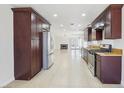 Bright kitchen with granite countertops, stainless appliances, and an open floor plan at 7139 Mountain Moss Dr, Las Vegas, NV 89147