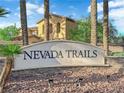 Close-up of the Nevada Trails community entrance sign in an upscale neighborhood with desert landscaping at 7183 Majestic Bluff Pl, Las Vegas, NV 89113