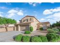 Two-story home with three-car garage, well-manicured landscaping, and a sunny sky background at 7183 Majestic Bluff Pl, Las Vegas, NV 89113