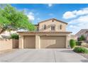 Beautiful home exterior showcasing a spacious three-car garage and well-maintained landscaping at 7183 Majestic Bluff Pl, Las Vegas, NV 89113