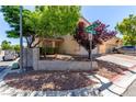Charming home with desert landscaping and a decorative block wall on a sunny corner lot at 7912 Horn Beam Ct, Las Vegas, NV 89131