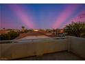 Panoramic view of a desert community under a twilight sky with palm trees and a cityscape visible in the distance at , Las Vegas, NV 89117