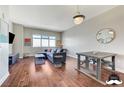 Open-concept living room with hardwood floors, dining table, and a comfortable sectional sofa at 150 Las Vegas Blvd # 1118, Las Vegas, NV 89101