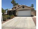 Inviting single-story home with a spacious driveway and two-car garage, perfect for comfortable living at 1800 Quail Point Ct, Las Vegas, NV 89117