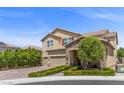Attractive two-story home includes a three-car garage, stone details, and well-maintained landscaping at 2400 Trissino Ct, Henderson, NV 89044