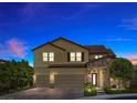 Stunning two-story home showcases a three-car garage, stone accents, and manicured landscaping under a twilight sky at 2400 Trissino Ct, Henderson, NV 89044