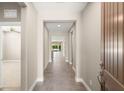 Long hallway leading to the bright, open living spaces, highlighting the home's seamless flow at 2434 Quiet Ode St, Henderson, NV 89044