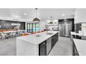 Modern kitchen with sleek countertops, stainless steel appliances, and an open design at 3189 Montecito Dr, Las Vegas, NV 89120
