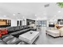 Spacious living room featuring modern furniture, sleek floors, and abundant natural light at 3189 Montecito Dr, Las Vegas, NV 89120