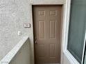 The front door features a secure lock and is protected by a modern screen at 3354 Indian Shadow St # 203, Las Vegas, NV 89129