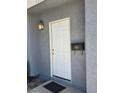 Close-up of the front door featuring a vintage mailbox at 3660 Haverhill St, Las Vegas, NV 89121