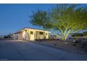 Well-maintained home featuring desert landscaping, a private driveway, and contemporary architectural style at 4070 N Tee Pee Ln, Las Vegas, NV 89129