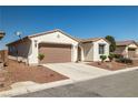Well-maintained single-story home with desert landscaping and a two-car garage at 4410 S Gressa St, Pahrump, NV 89061