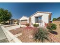 Single-story home featuring desert landscaping and a two-car garage at 4410 S Gressa St, Pahrump, NV 89061