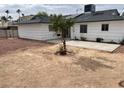 Spacious backyard with desert landscaping and potential for customization with a tree in the center at 4564 Dennis Way, Las Vegas, NV 89121