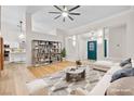 Bright living room with contemporary furnishings, stylish decor, and an open concept layout leading to the kitchen at 5009 Elm Grove Dr, Las Vegas, NV 89130