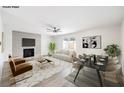This living room boasts a cozy atmosphere with a fireplace, sleek furnishings and modern decor at 516 Donner St, Las Vegas, NV 89107