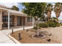 Well-manicured front yard with mature trees and a welcoming entrance at 5260 Styers St, North Las Vegas, NV 89031