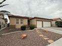 Attractive single-story home with desert landscaping and a two-car garage at 5318 Rio Eldorado Ct, North Las Vegas, NV 89031