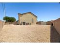 Large backyard with a blank canvas. Gravel landscaping with block wall surround at 6088 Gulf Island Ave, Las Vegas, NV 89156