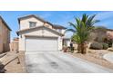 Charming two-story home featuring an attached two-car garage and desert landscaping at 6141 Annville Ct, North Las Vegas, NV 89081