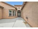 Stylish entrance featuring patterned glass doors and a beautifully landscaped courtyard at 7404 Eggshell Dr, North Las Vegas, NV 89084