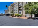Condo building with stucco exterior and stairs leading to entrance at 745 N Royal Crest Cir # 127, Las Vegas, NV 89169