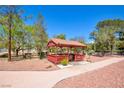 Outdoor gazebo with red roof and pillars, set amongst trees at 745 N Royal Crest Cir # 127, Las Vegas, NV 89169