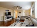 Inviting living room boasts a large sectional, stylish decor, and bright natural light at 7611 Redcloud Peak St St, Las Vegas, NV 89166