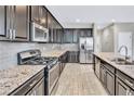 Well-equipped kitchen with stainless steel appliances, granite countertops, and sleek cabinetry at 7624 Mallard Bay Ave, Las Vegas, NV 89179