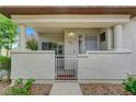Charming front porch featuring a gated entrance with desert-style landscaping at 8012 Desire Ave, Las Vegas, NV 89128
