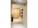 Bright hallway featuring wood floors, a recessed art niche, and a double front door at 8225 Fulton Ranch St, Las Vegas, NV 89131
