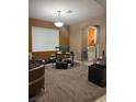 Cozy living room with window, desk, and decorative lighting at 109 Delighted Ave, North Las Vegas, NV 89031