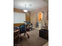 Cozy living room with window, desk, and decorative lighting at 109 Delighted Ave, North Las Vegas, NV 89031