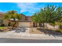 Well-maintained home with a tidy lawn, desert landscaping, and a spacious two-car garage at 11285 Fiesole St, Las Vegas, NV 89141