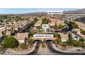 Aerial view of a community with a swimming pool and easy access to the freeway at 1185 Via Dimartini, Henderson, NV 89052