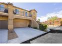 Charming two-story home with a two-car garage, a small balcony and well-kept landscaping at 1185 Via Dimartini, Henderson, NV 89052