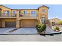 Charming two-story home with a two-car garage, a small balcony and well-kept landscaping at 1185 Via Dimartini, Henderson, NV 89052