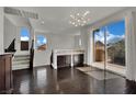Bright and airy living room with large windows and sliding glass doors to patio at 1185 Via Dimartini, Henderson, NV 89052