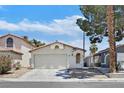 Charming one-story home featuring a two-car garage and well-manicured landscaping at 1356 Pleasant Brook St, Las Vegas, NV 89142