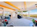 Bright open living room with large windows showcasing panoramic views and wood beam ceiling at 1409 Pueblo Dr, Boulder City, NV 89005