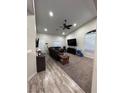Neutral living room featuring neutral walls, recessed lighting, carpeted floors and ceiling fan at 1619 Tangerine Rose Dr, Las Vegas, NV 89142