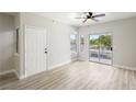 Well-lit living room featuring light wood floors, an exterior door, and a sliding glass door at 2201 Ramsgate Dr # 327, Henderson, NV 89074