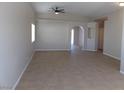 Bright living room with high ceilings, neutral paint, tile floors, and a ceiling fan at 319 Mulberry Glen Dr, North Las Vegas, NV 89031