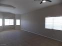Spacious living room featuring tile floors and lots of natural light from large windows at 319 Mulberry Glen Dr, North Las Vegas, NV 89031