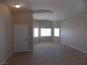 Open concept living room featuring tile floors and lots of natural light at 319 Mulberry Glen Dr, North Las Vegas, NV 89031