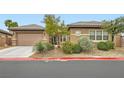 Charming one-story home with a two-car garage and well-maintained desert landscaping at 3805 Specula Wing Dr, North Las Vegas, NV 89084